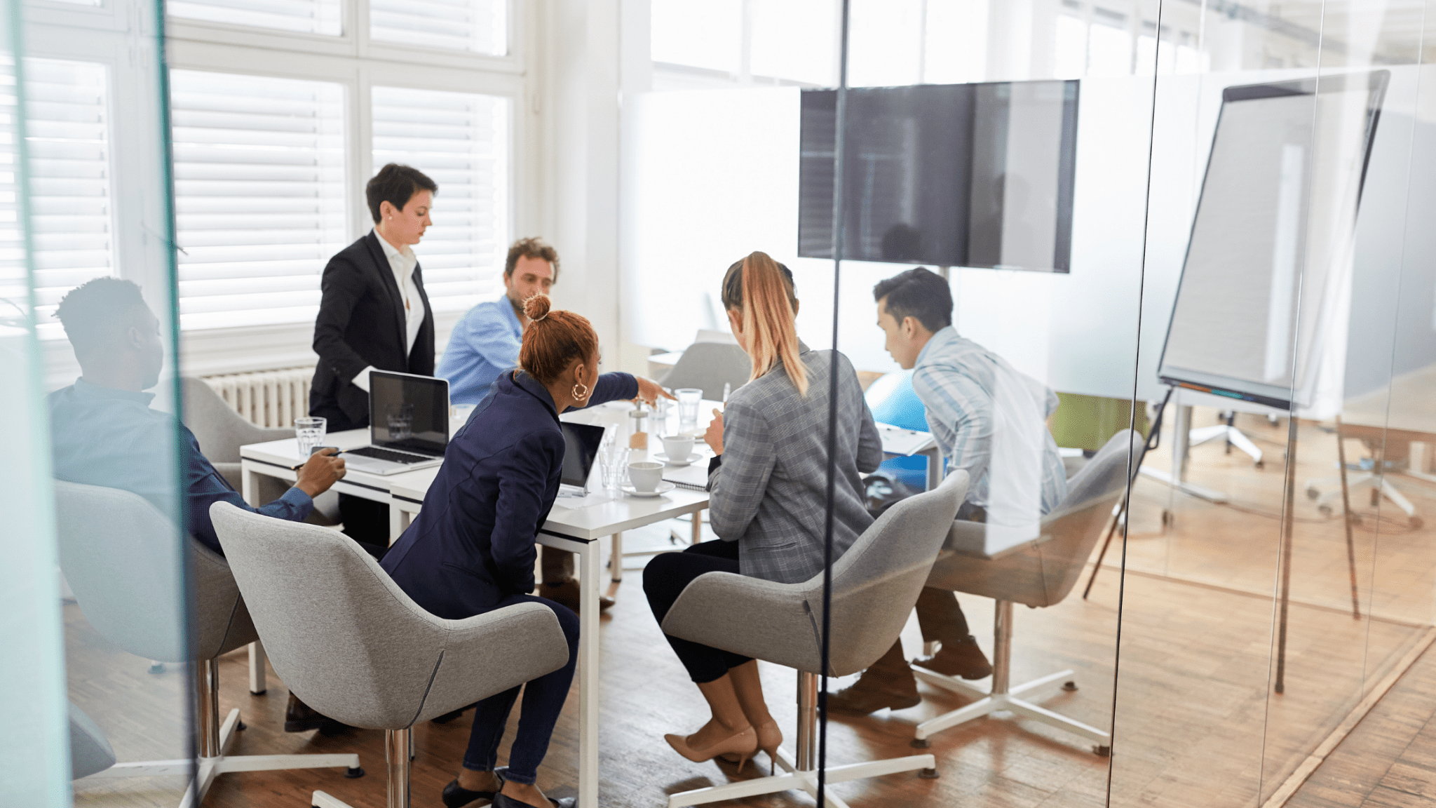 People in a meeting choosing the best IT Services company for their needs