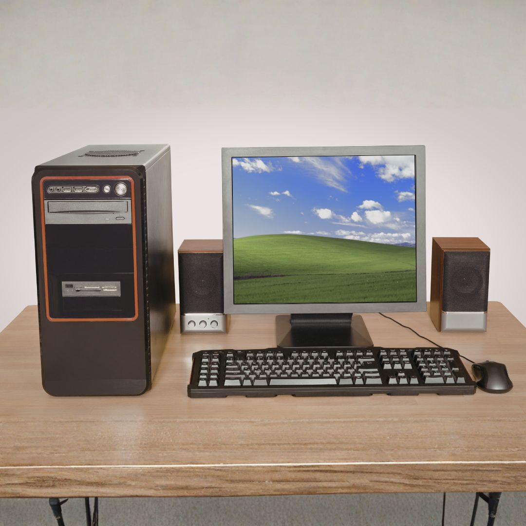 old 2000s computer and with the classic Dell hill wallpaper