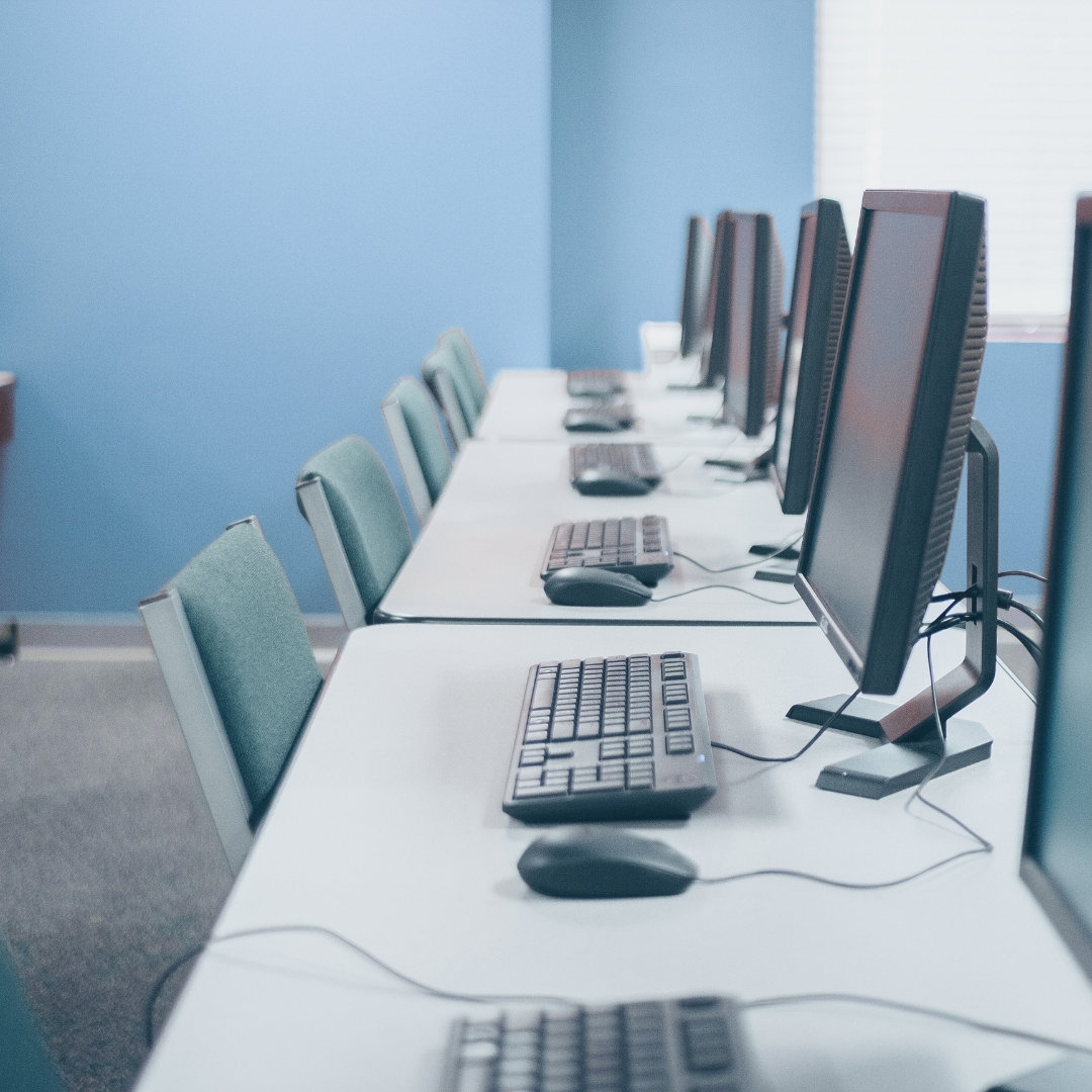 A row of computers in an office